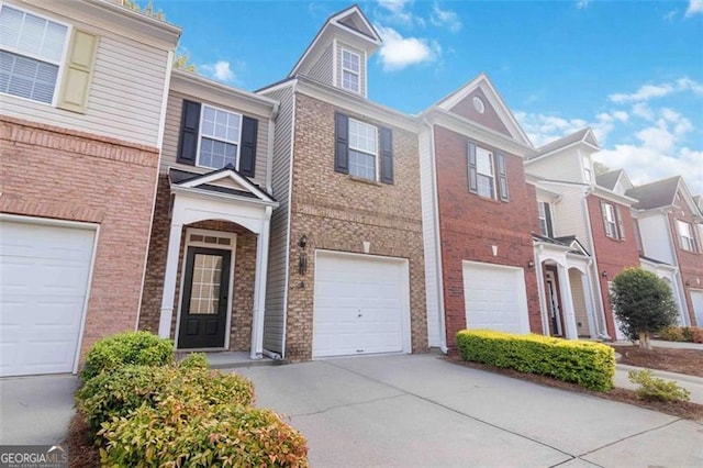 2457 Birkhall Way, Lawrenceville, GA 30043 - view of property featuring driveway, brick siding, and a garage