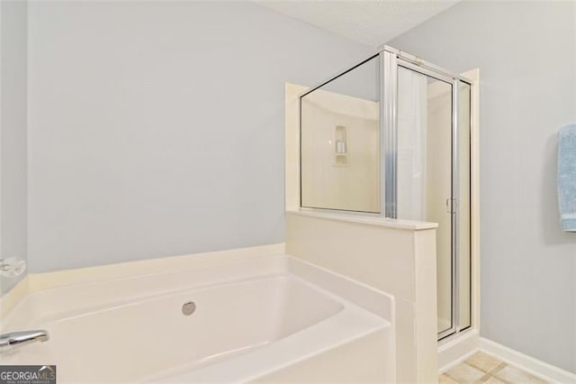 2457 Birkhall Way, Lawrenceville, GA 30043 - bathroom featuring a bath and a shower stall