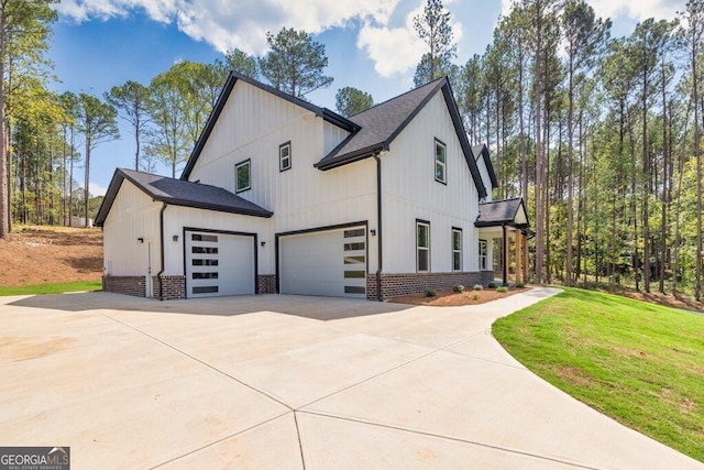 83 Beech Creek Cir, Winder, GA 30680 - view of side of property featuring brick siding, concrete driveway, roof with shingles, and a lawn
