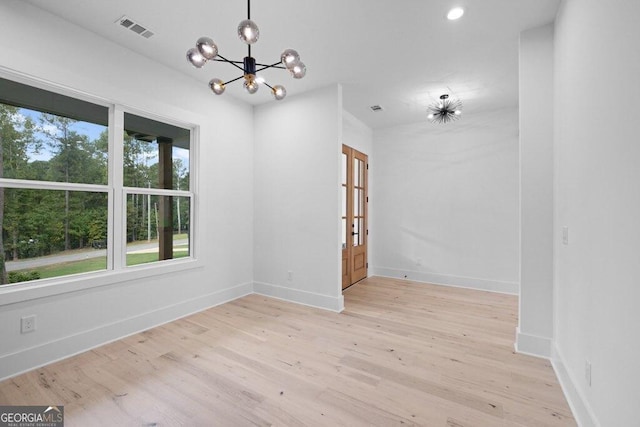 83 Beech Creek Cir, Winder, GA 30680 - spare room featuring a chandelier, light wood-style floors, baseboards, and recessed lighting