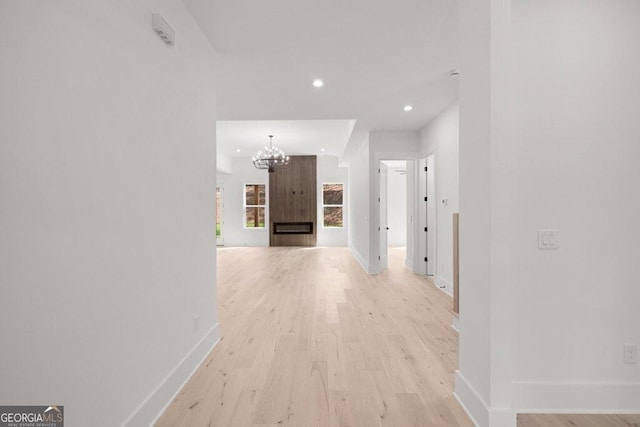 83 Beech Creek Cir, Winder, GA 30680 - hallway featuring baseboards, a chandelier, recessed lighting, and light wood-type flooring