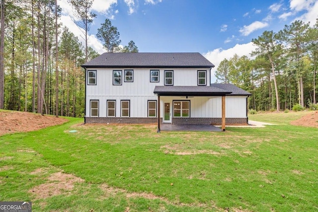 83 Beech Creek Cir, Winder, GA 30680 - back of property featuring a patio area, a yard, and a ceiling fan