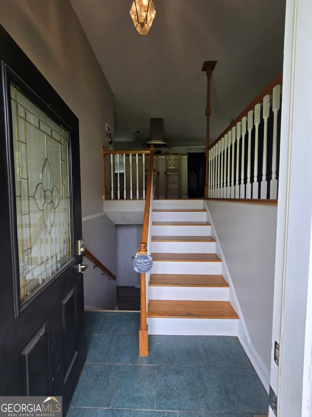 1214 Tucker Rd, Perry, GA 31069 - foyer featuring stairs and baseboards