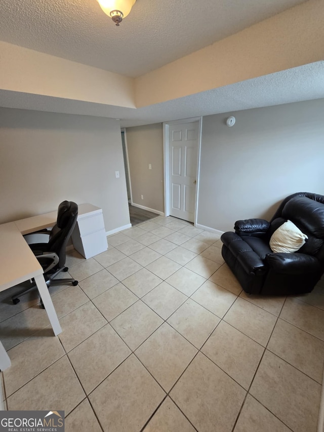 1214 Tucker Rd, Perry, GA 31069 - office space featuring light tile patterned floors, baseboards, and a textured ceiling