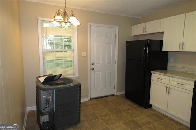 490 Culberson St SW, Atlanta, GA 30310 - kitchen with freestanding refrigerator, a chandelier, white cabinetry, light countertops, and ornamental molding