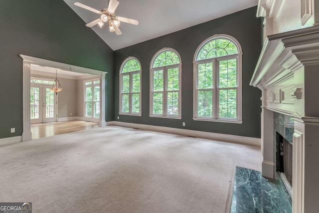 3801 Stonebriar Ln, Duluth, GA 30097 - unfurnished living room featuring high vaulted ceiling, a premium fireplace, carpet floors, ceiling fan, and baseboards