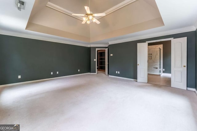 3801 Stonebriar Ln, Duluth, GA 30097 - unfurnished bedroom featuring a tray ceiling, carpet flooring, ornamental molding, baseboards, and a ceiling fan