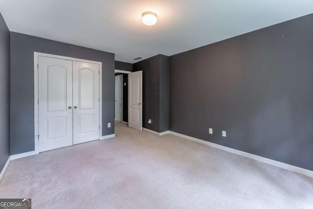 3801 Stonebriar Ln, Duluth, GA 30097 - unfurnished bedroom featuring carpet floors, baseboards, and a closet