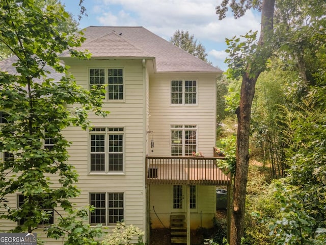 3801 Stonebriar Ln, Duluth, GA 30097 - rear view of property featuring a deck and roof with shingles
