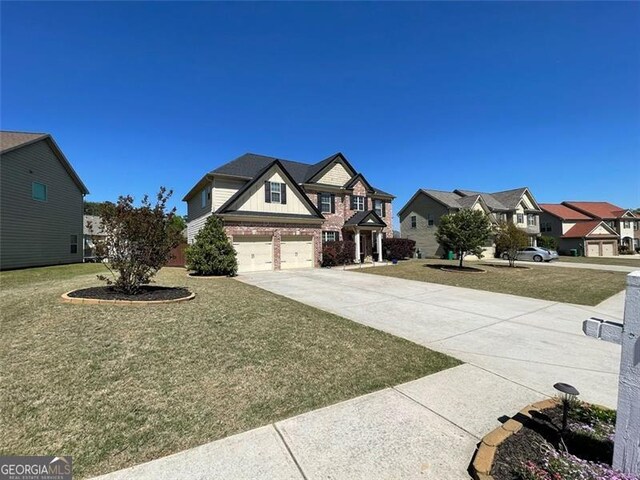 2030 Hydrangea Ln, Austell, GA 30106 - view of grassy yard with an attached garage, concrete driveway, and a residential view