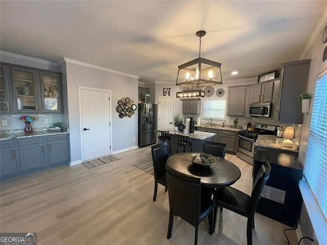 2030 Hydrangea Ln, Austell, GA 30106 - dining room with a chandelier, light wood finished floors, and ornamental molding