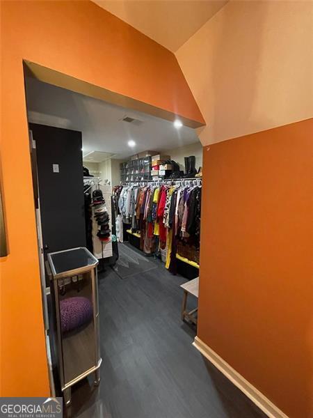 2030 Hydrangea Ln, Austell, GA 30106 - walk in closet with dark wood-type flooring