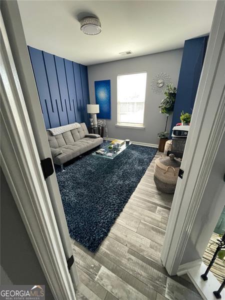 2030 Hydrangea Ln, Austell, GA 30106 - living room featuring wood finished floors and baseboards