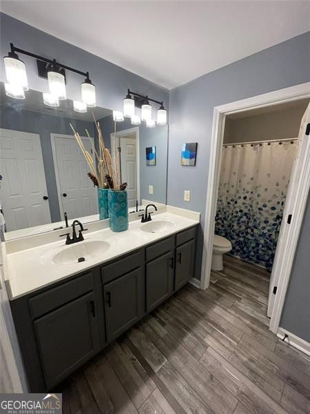 2030 Hydrangea Ln, Austell, GA 30106 - bathroom featuring wood finished floors and double vanity
