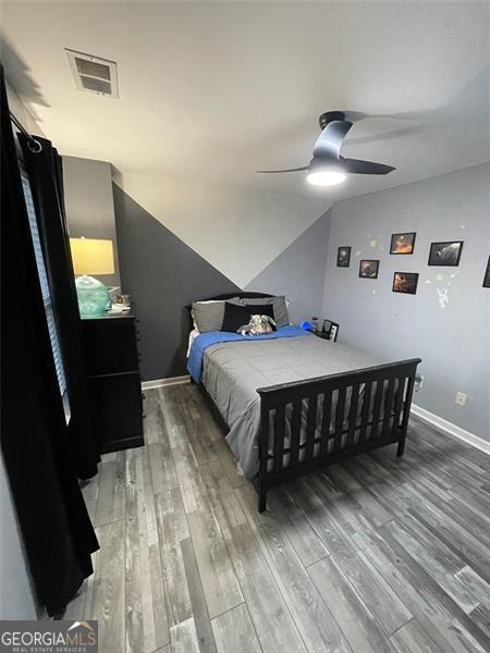 2030 Hydrangea Ln, Austell, GA 30106 - bedroom with light wood-style flooring, a ceiling fan, and lofted ceiling