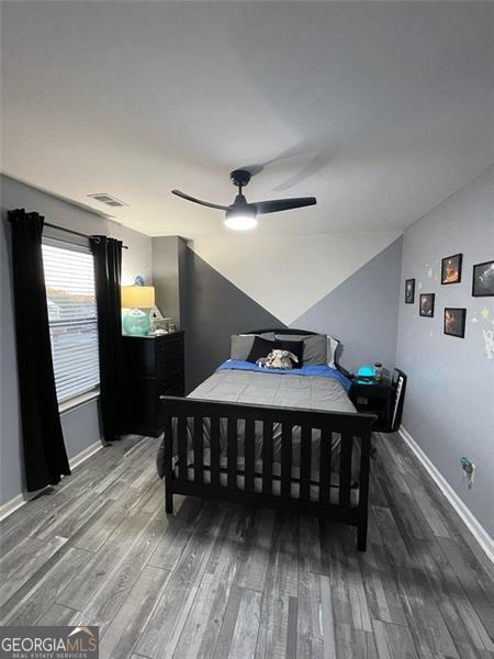 2030 Hydrangea Ln, Austell, GA 30106 - bedroom with wood finished floors, ceiling fan, and lofted ceiling