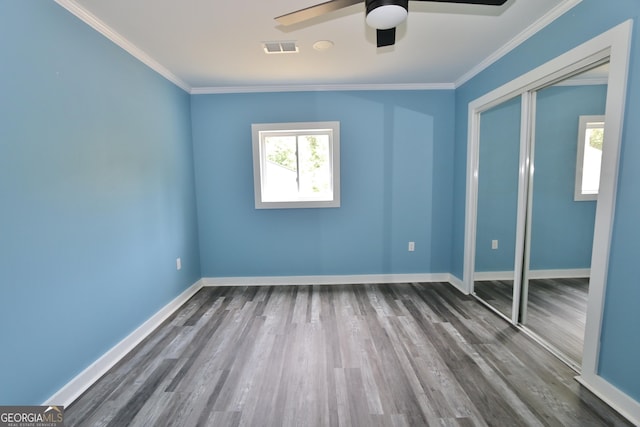 3434 Union Point Rd, Union Point, GA 30669 - unfurnished bedroom featuring wood finished floors, a closet, ornamental molding, ceiling fan, and baseboards