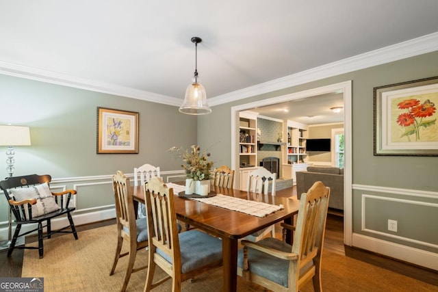 5676 Mount Berry Ln, Peachtree Corners, GA 30092 - dining area with crown molding, light wood-type flooring, and a wainscoted wall