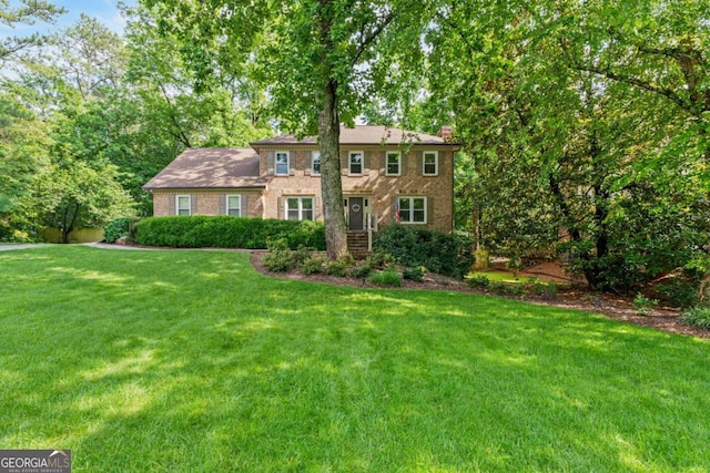 5676 Mount Berry Ln, Peachtree Corners, GA 30092 - colonial-style house with a front lawn and brick siding