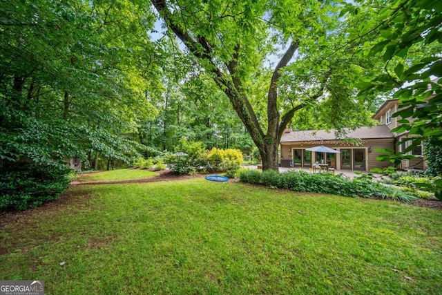 5676 Mount Berry Ln, Peachtree Corners, GA 30092 - view of grassy yard with a patio area