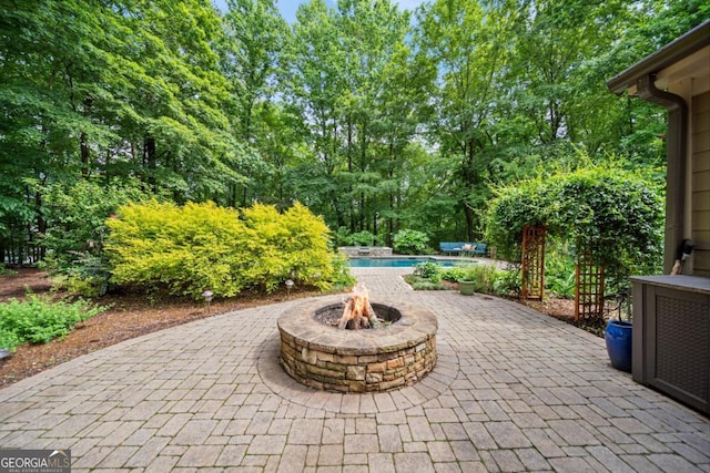 5676 Mount Berry Ln, Peachtree Corners, GA 30092 - view of patio / terrace featuring an outdoor fire pit and an outdoor pool