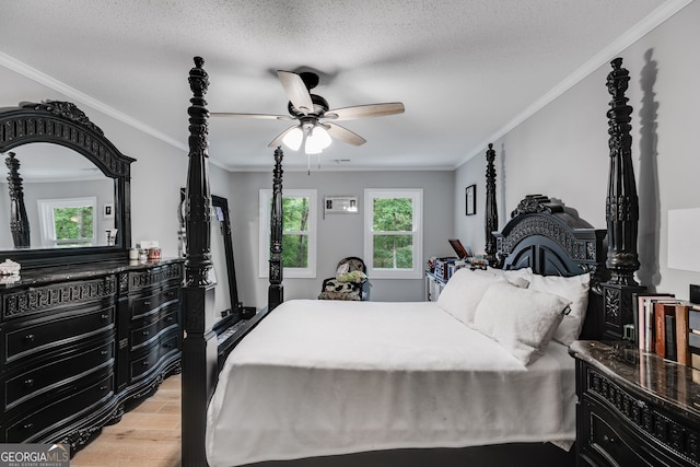 212 Teepee Trl, Whitesburg, GA 30185 - bedroom featuring light wood-style floors, crown molding, a ceiling fan, and a textured ceiling