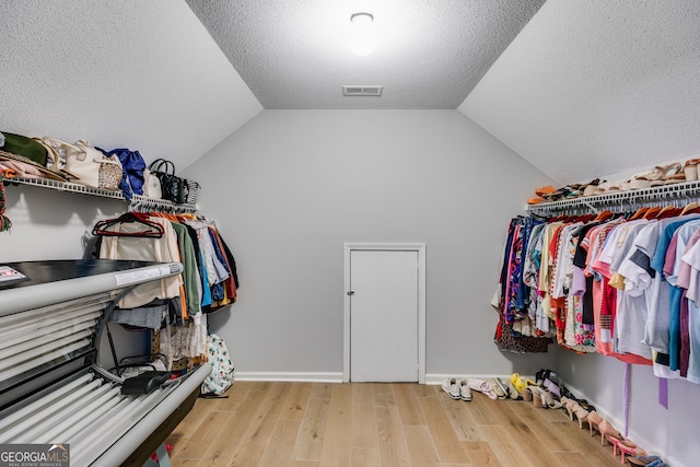 212 Teepee Trl, Whitesburg, GA 30185 - spacious closet with wood finished floors and lofted ceiling