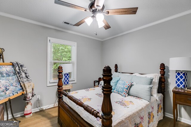 212 Teepee Trl, Whitesburg, GA 30185 - bedroom with wood finished floors, crown molding, and ceiling fan