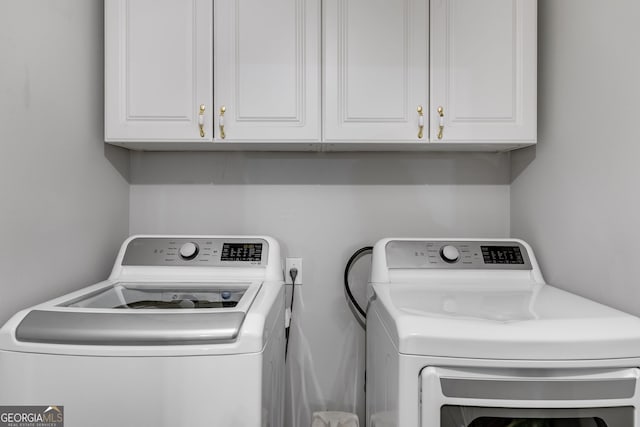 212 Teepee Trl, Whitesburg, GA 30185 - laundry room featuring cabinet space and washing machine and dryer