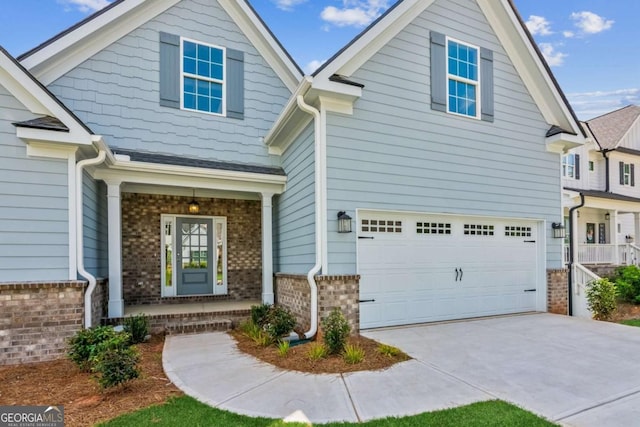 4300 Links Blvd, Jefferson, GA 30549 - craftsman-style house with a porch, an attached garage, brick siding, and driveway