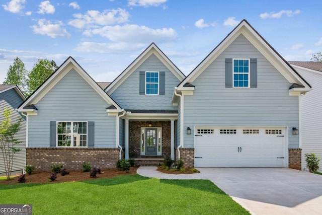 4300 Links Blvd, Jefferson, GA 30549 - view of front of home featuring brick siding, driveway, and a front yard
