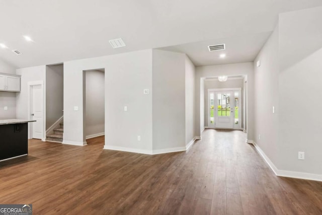 4300 Links Blvd, Jefferson, GA 30549 - unfurnished living room featuring dark wood-style floors, baseboards, stairs, and recessed lighting