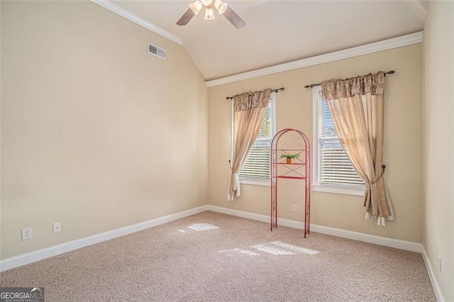 1241 Edgebrook, Snellville, GA 30078 - empty room featuring crown molding, ceiling fan, carpet floors, and vaulted ceiling