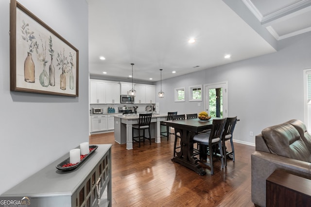 8 Saint Charles Ave, Sharpsburg, GA 30277 - dining area featuring recessed lighting, dark wood-style flooring, and crown molding