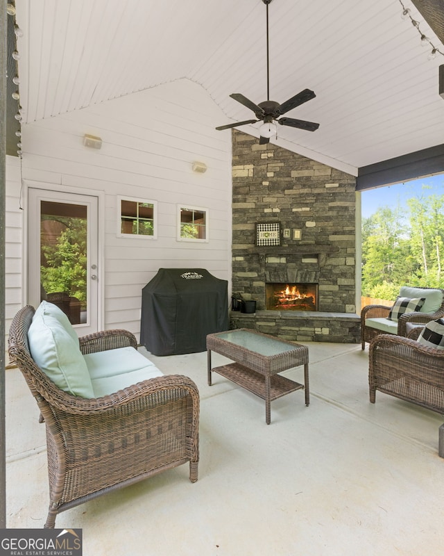 8 Saint Charles Ave, Sharpsburg, GA 30277 - view of patio featuring an outdoor stone fireplace, a ceiling fan, and grilling area