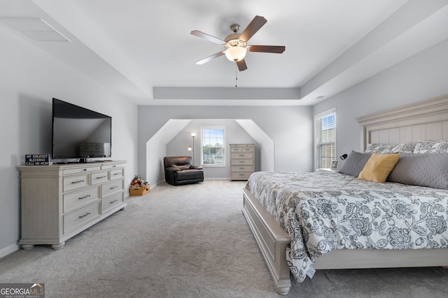 8 Saint Charles Ave, Sharpsburg, GA 30277 - bedroom featuring a tray ceiling, light colored carpet, and a ceiling fan