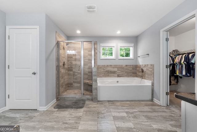 8 Saint Charles Ave, Sharpsburg, GA 30277 - full bathroom featuring a garden tub, a shower stall, baseboards, a spacious closet, and recessed lighting