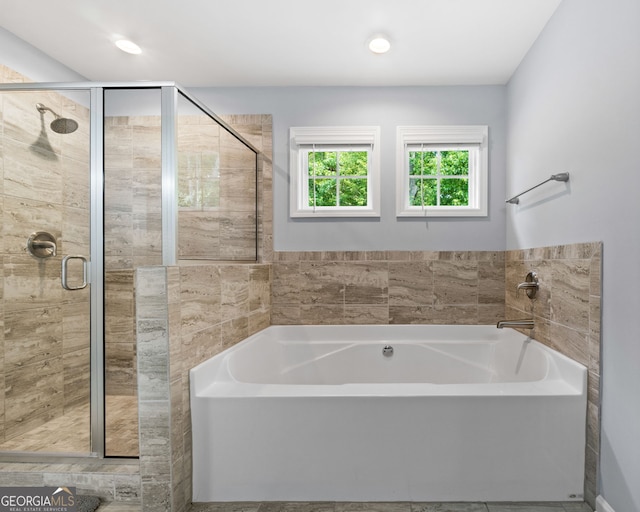 8 Saint Charles Ave, Sharpsburg, GA 30277 - bathroom with a garden tub and a stall shower