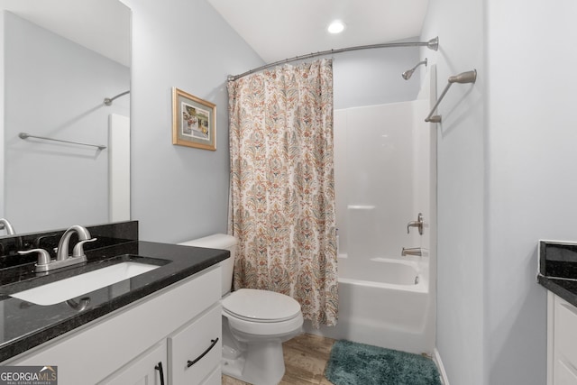 8 Saint Charles Ave, Sharpsburg, GA 30277 - bathroom featuring vanity, shower / bath combination with curtain, toilet, and wood finished floors