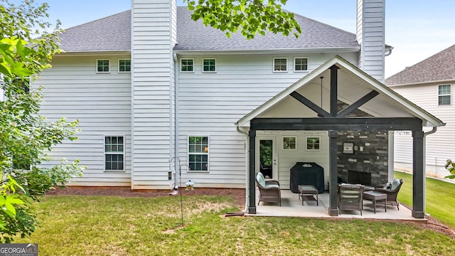 8 Saint Charles Ave, Sharpsburg, GA 30277 - back of house featuring a chimney, a patio area, roof with shingles, and a yard