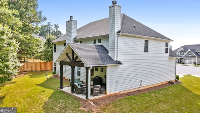 8 Saint Charles Ave, Sharpsburg, GA 30277 - rear view of house with a patio area, a shingled roof, and a chimney