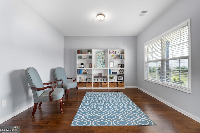 8 Saint Charles Ave, Sharpsburg, GA 30277 - living area with baseboards and dark wood finished floors
