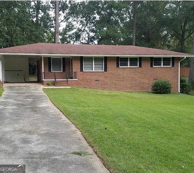 2935 Southshore Dr, Macon, GA 31204 - ranch-style home featuring a front yard, driveway, a carport, and brick siding