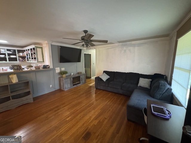 2935 Southshore Dr, Macon, GA 31204 - living room with wood finished floors, a ceiling fan, and ornamental molding