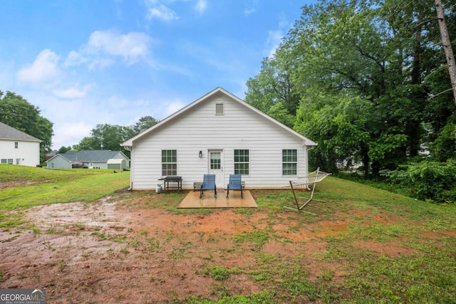 1672 Meadow Lark Ln, Gainesville, GA 30501 - rear view of property featuring a lawn and a patio area