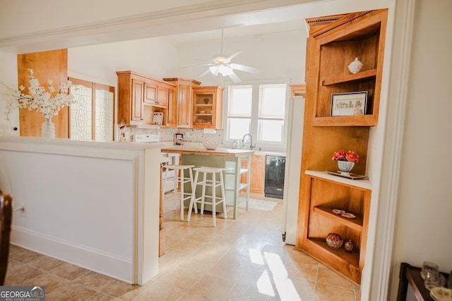 428 Elm St, Barnesville, GA 30204 - kitchen featuring open shelves, white stove, ceiling fan, light countertops, and a kitchen bar