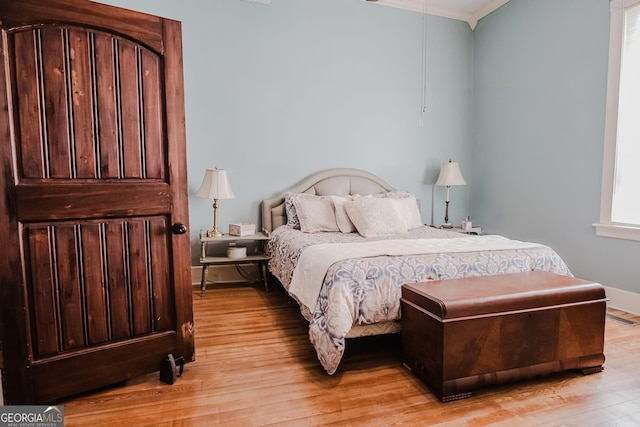 428 Elm St, Barnesville, GA 30204 - bedroom with ornamental molding and light wood-style flooring