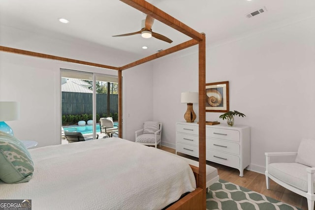 616 Neptune Way, Saint Simons, GA 31522 - bedroom featuring access to outside, recessed lighting, wood finished floors, and ceiling fan