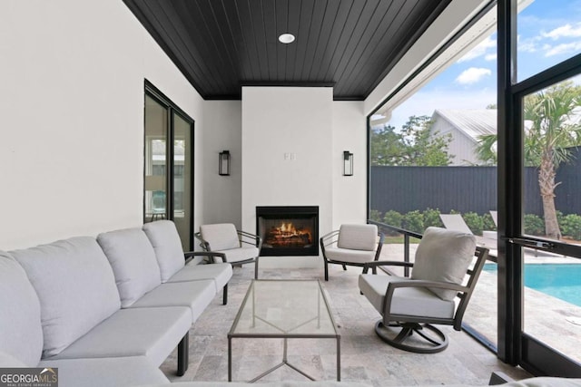 616 Neptune Way, Saint Simons, GA 31522 - view of patio / terrace with an outdoor living space with a fireplace
