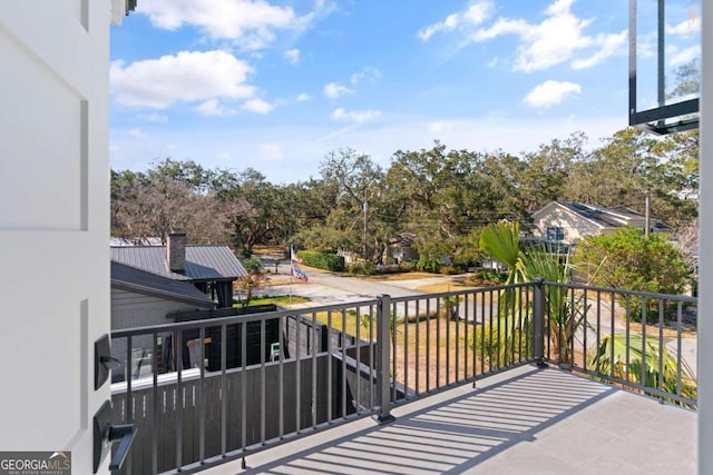 616 Neptune Way, Saint Simons, GA 31522 - balcony featuring view of wooded area